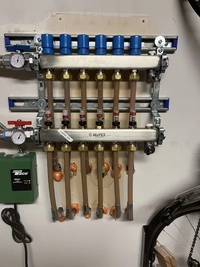 Plumber performing Water Heater Repair at a residential property in South Fayette